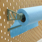 Paper Towel Holder with Tear-Off Bar in Muted Green on IKEA SKADIS pegboard with blue shop towels.