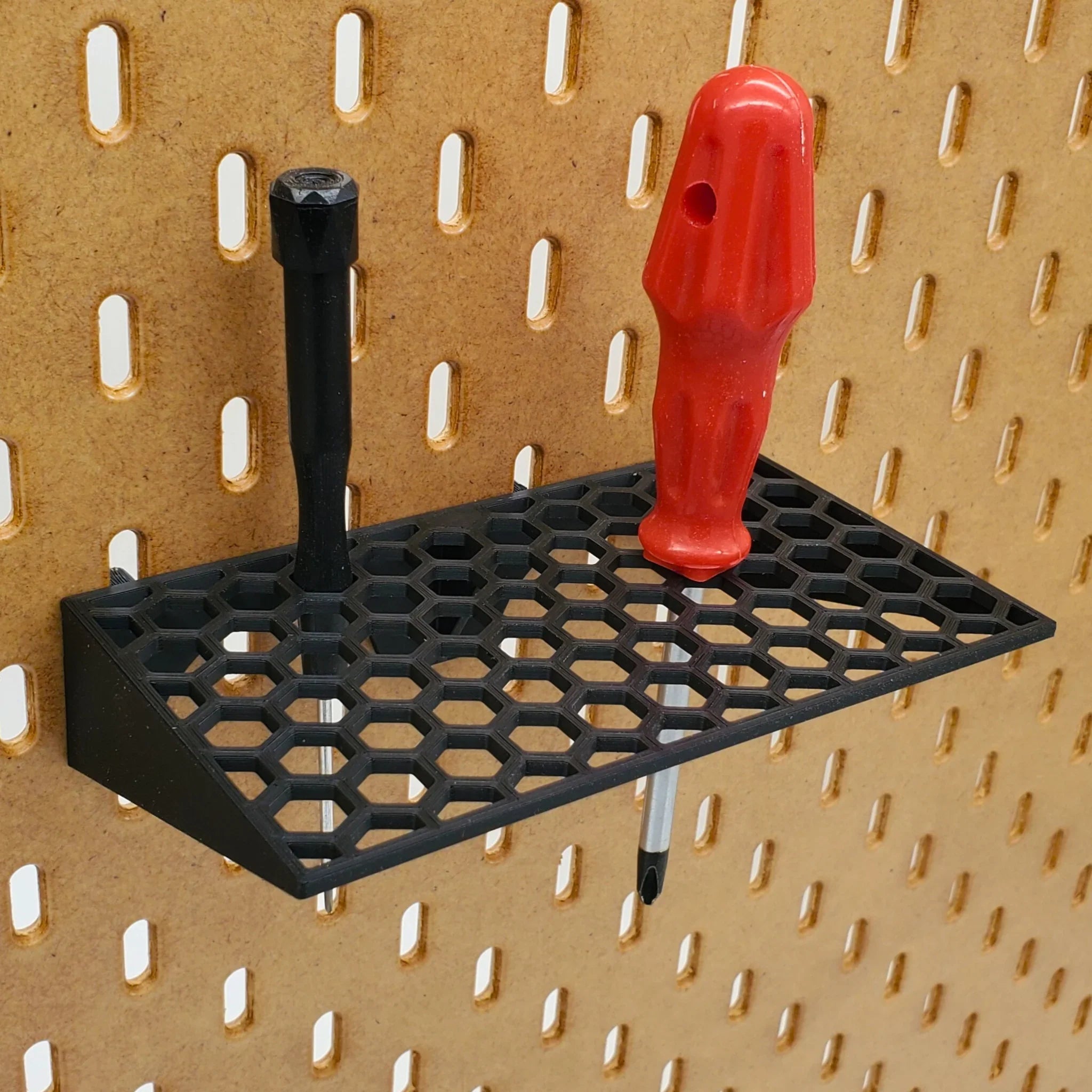 Screwdriver Holder with 60 hexagons in Charcoal Black on IKEA SKADIS pegboard.