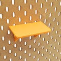 Small Shallow Shelf in Sunrise Orange on IKEA SKADIS pegboard.