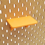 Small Shallow Shelf in Sunrise Orange on IKEA SKADIS pegboard.
