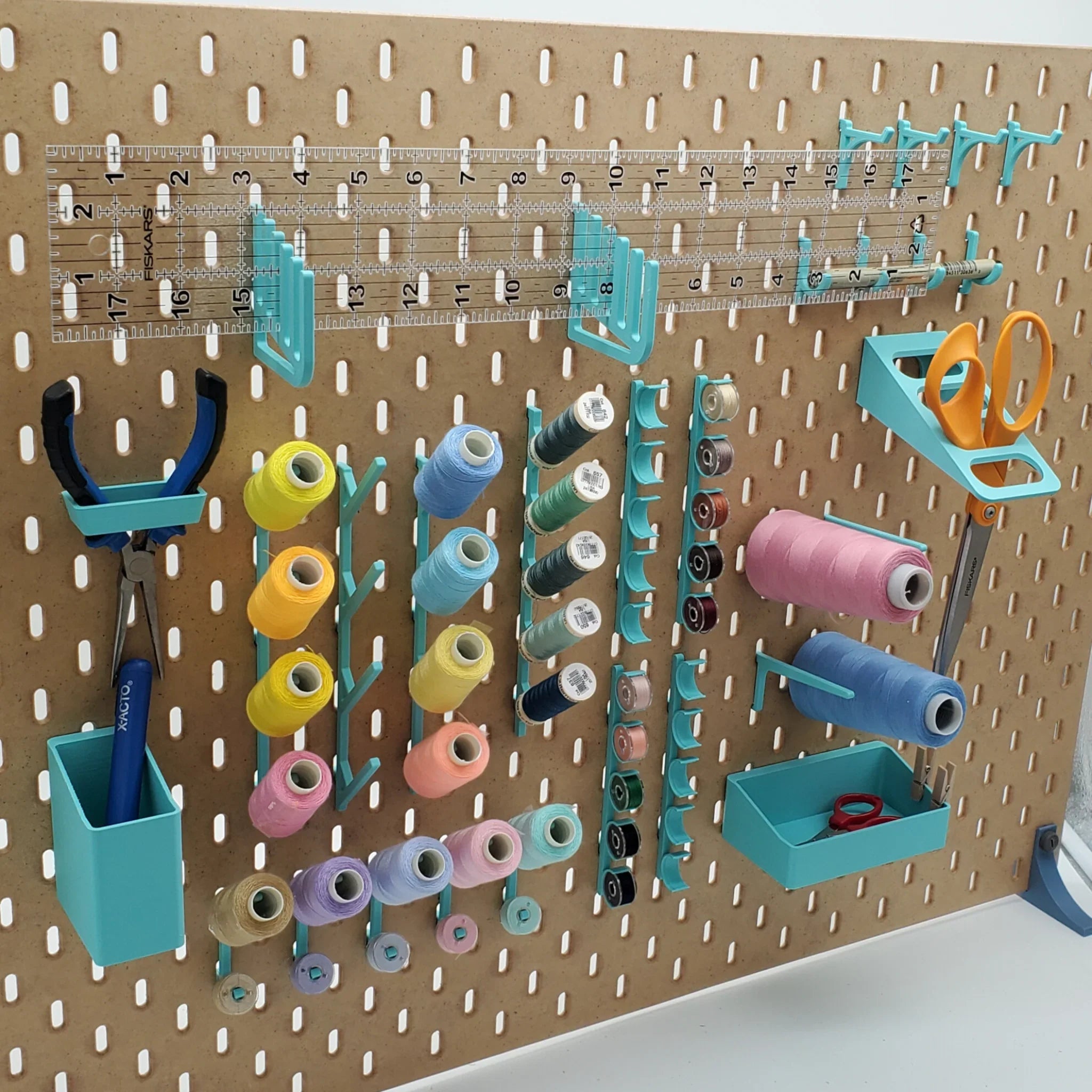 Medium Sewing Organizer Kit in Teal on IKEA SKADIS pegboard with sewing notions and tools