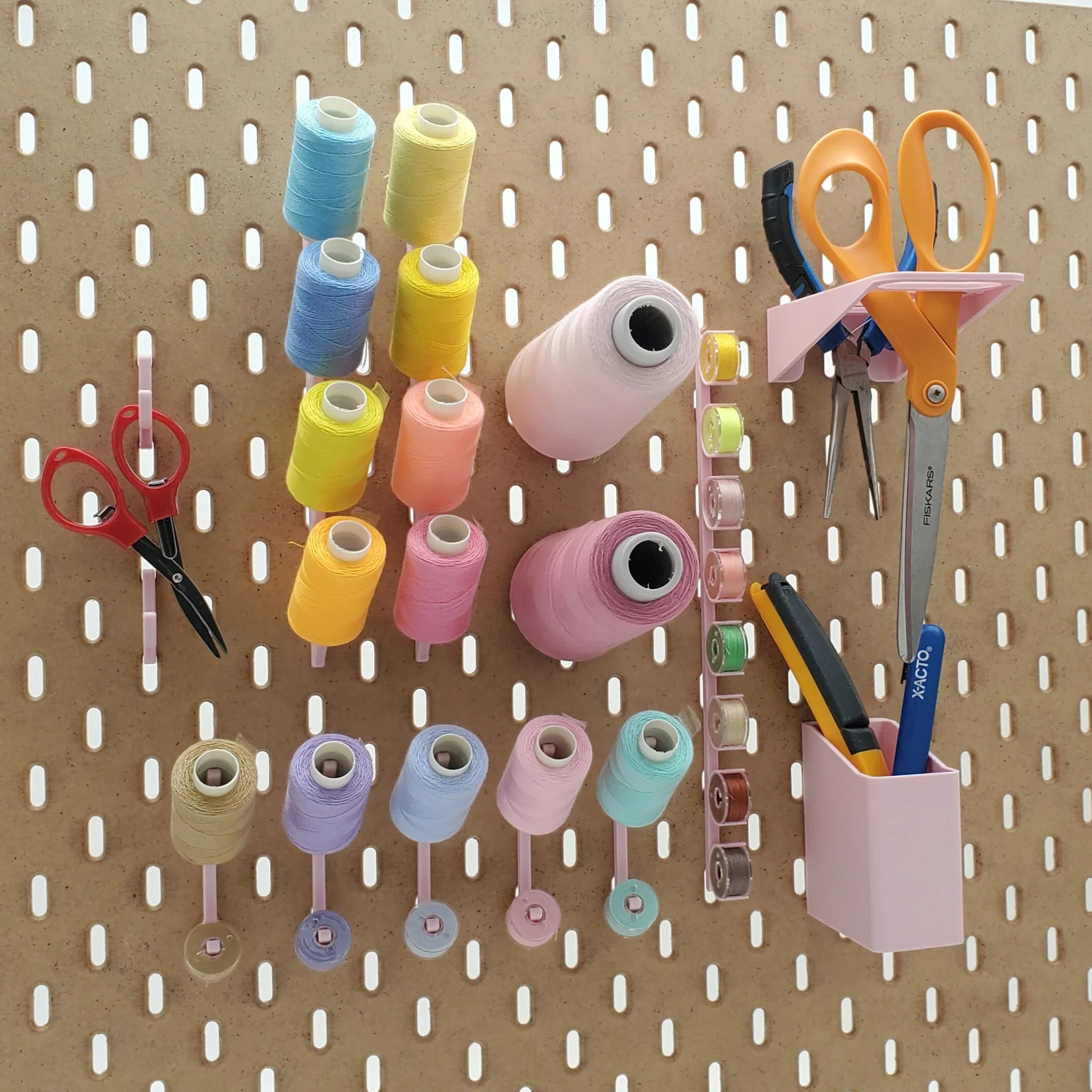 Small Sewing Organizer Kit in Light Pink on IKEA SKADIS pegboard with sewing notions and tools.