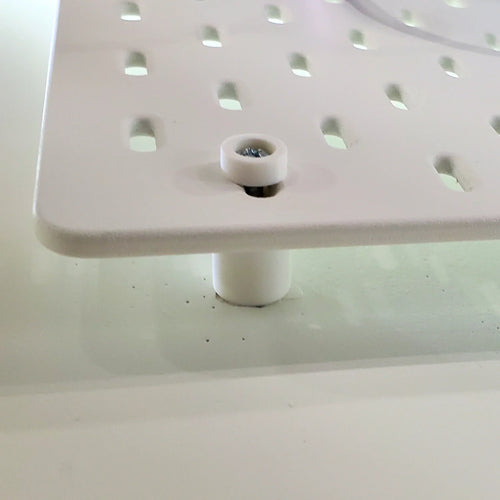 Detail of Mounting Hardware Kit in Cotton White on IKEA SKADIS pegboard.
